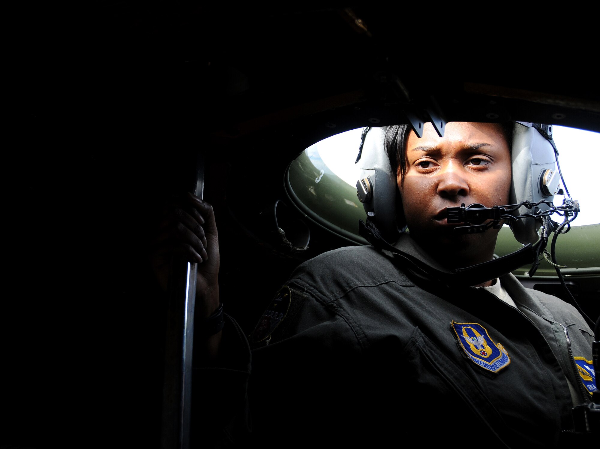 Senior Airman Natasha Lee, 700th Airlift Squadron loadmaster, rests her eyes after scanning the skies for danger from the rear vision device, also known as the bubble, of a C-130 Hercules as it flies over the Nevada Testing and Training Range during Red Flag 16-2 March 1, 2016. Red Flag missions are conducted on the 2.9 million acre NTTR with 1,900 possible targets, realistic threat systems and opposing enemy forces. (U.S. Air Force photo/Staff Sgt. Daniel Phelps)
