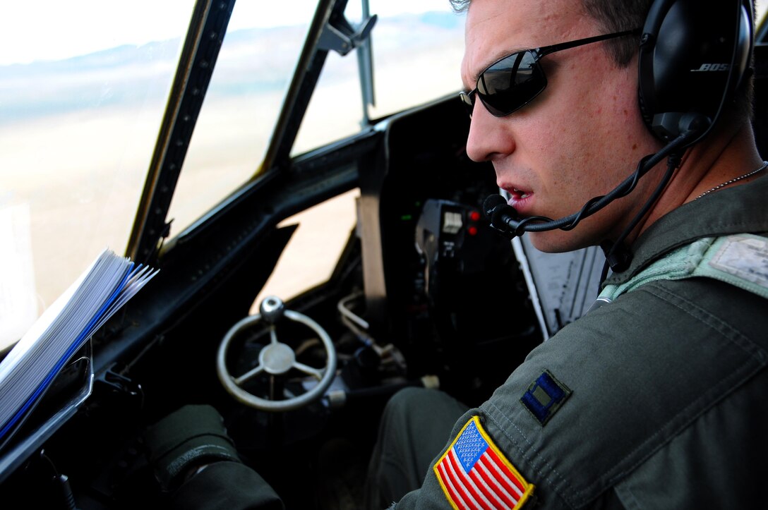 Capt. Michael Edwards, 700th Airlift Squadron C-130 Hercules pilot, scans the ground during Red Flag 16-2 March 1, 2016. The 700th AS is stationed out of Dobbins Air Reserve Base, Ga. Flying units from around the globe deploy to Nellis Air Force Base, Nev. to participate in Red Flag. (U.S. Air Force photo/Staff Sgt. Daniel Phelps)
