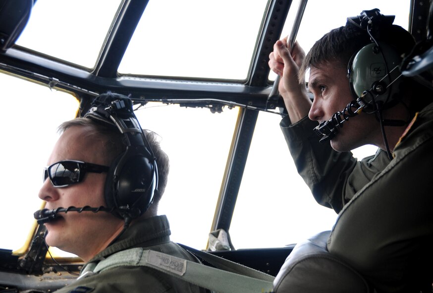 Capt. Justin Howell, 700th Airlift Squadron C-130 Hercules pilot, and Capt. Sam Smith, 700th AS navigator, scan the ground for way points during Red Flag 16-2 March 1, 2016. The 700th AS is stationed out of Dobbins Air Reserve Base, Ga. Flying units from around the globe deploy to Nellis Air Force Base, Nev. to participate in Red Flag. (U.S. Air Force photo/Staff Sgt. Daniel Phelps)
