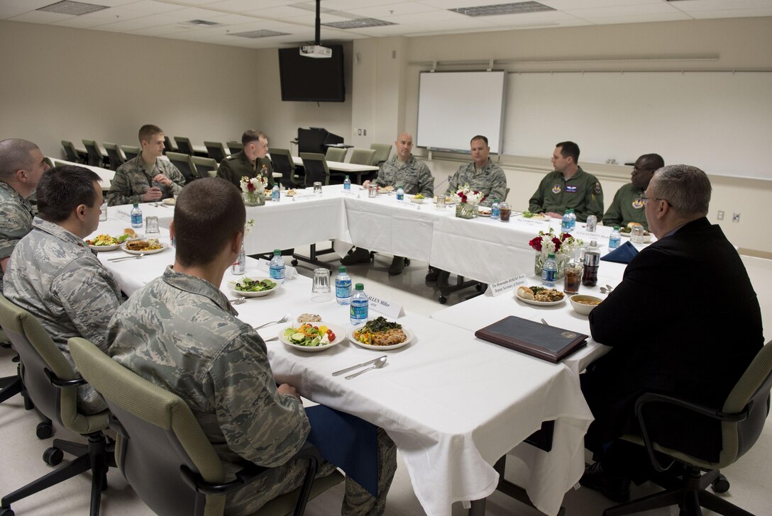 Deputy Defense Secretary Bob Work has lunch with military members enrolled in The Air Force Institute of Technology during a visit to Wright-Patterson Air Force Base, Ohio, March 3, 2016. AFIT is a graduate school and provider of professional and continuing education for the United States Armed Forces. DoD photo by Air Force Senior Master Sgt. Adrian Cadiz