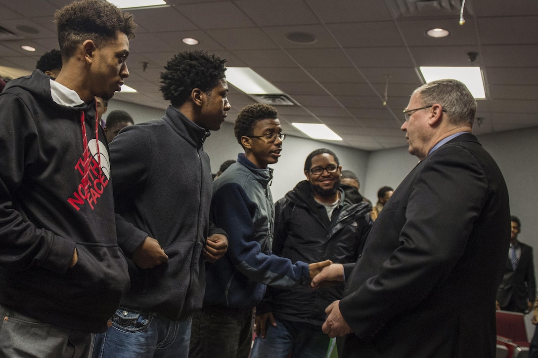 Deputy Defense Secretary Bob Work shakes hands with students after speaking to them during a Week at the Labs event at Wright-Patterson Air Force Base, Ohio, March 3, 2016. DoD photo by Air Force Senior Master Sgt. Adrian Cadiz
