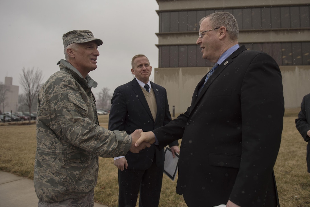 Deputy Defense Secretary Bob Work, right, says goodbye to Air Force Maj. Gen. Thomas J. "Tom" Masiello, commander, Air Force Research Laboratory as he prepares to depart Wright-Patterson Air Force Base, Ohio, after touring the base and speaking to a group of students from the local Dayton, Ohio, area during 'Week at the Labs" event March 3, 2016. DoD photo by Air Force Senior Master Sgt. Adrian Cadiz