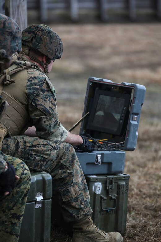 A Marine with  Explosive Ordnance Disposal  Platoon, Combat Logistics Battalion 2, operates the command console for a TALON robot to sweep for improvised explosive devices during a field exercise at Camp Lejeune, N.C., March 2, 2016. The training served as the last field operation prior to the battalion’s upcoming deployment with the Special Purpose Marine-Air Ground Task Force Crisis Response-Africa. (U.S. Marine Corps photo by Cpl. Paul S. Martinez/Released)