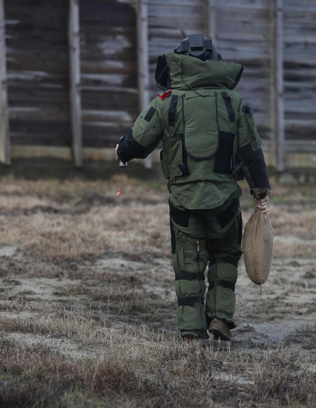 A Marine with Explosive Ordnance Disposal  Platoon, Combat Logistics Battalion 2, prepares to lay down a sandbag during a field exercise at Camp Lejeune, N.C., March 2, 2016. The training served as the last field operation prior to the battalion’s upcoming deployment with the Special Purpose Marine-Air Ground Task Force-Crisis Response-Africa. (U.S. Marine Corps photo by Cpl. Paul S. Martinez/Released)