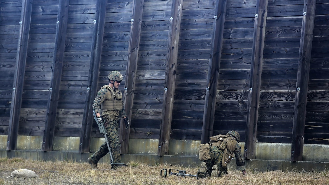 Marines with Explosive Ordnance Disposal  Platoon, Combat Logistics Battalion 2, utilize a compact metal detector to sweep for improvised explosive devices during a field exercise at Marine Corps Base Camp Lejeune, N.C., March 2, 2016. Marines utilized equipment such as compact metal detectors, bomb suits and a  TALON robot to locate and handle ordnance, which took the form of a simulated IED, ammunition or artillery shell.
