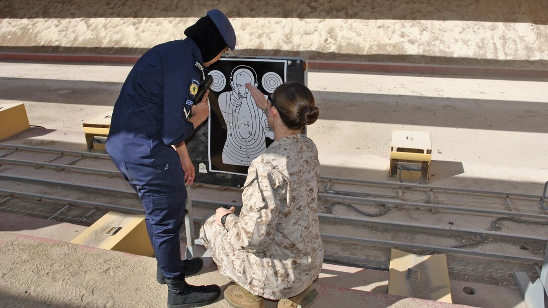 U.S. Marine Cpl. Leslie Souza, assigned to the 26th Marine Expeditionary Unit, reviews a target during live-fire training with the Kuwait Ministry of the Interior VIP Protection Unit, Female Division during an exchange with the 26th MEU’s Female Engagement Team Jan. 31 to Feb. 11, 2016, in Kuwait City, Kuwait. The 26th MEU is embarked on the Kearsarge Amphibious Ready Group and is deployed to maintain regional security in the U.S. 5th Fleet area of operations.