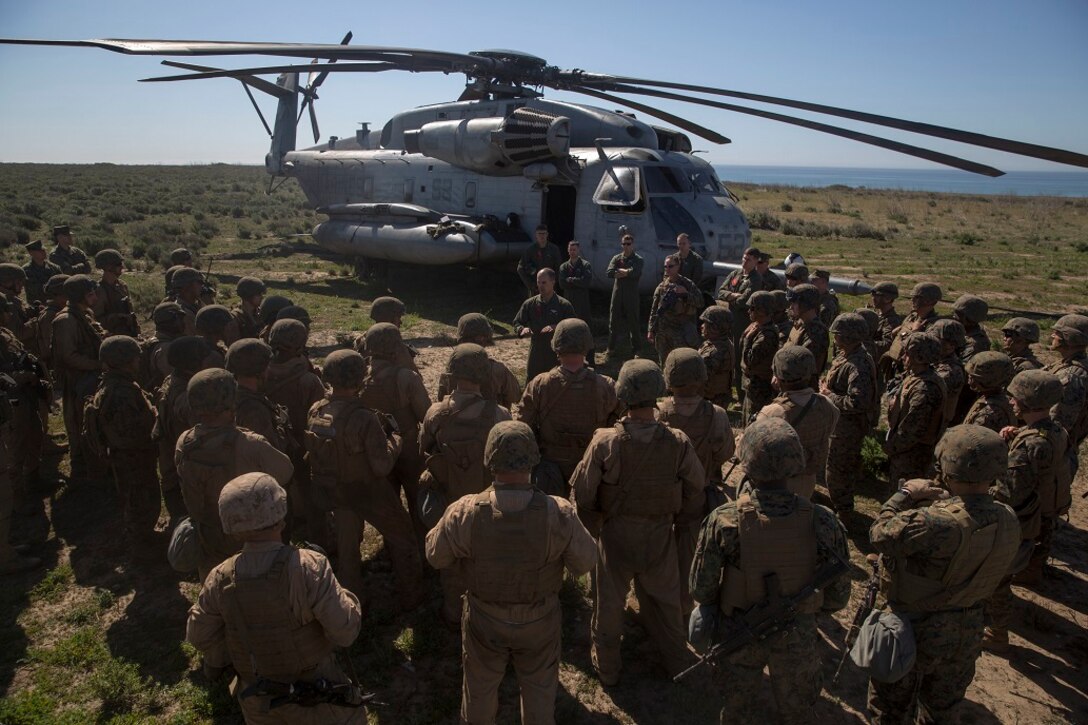 Gunnery Sgt. Jeremiah Wilcox instructs Amphibious Assault Vehicle crew members on the limitations, capabilities and refuel procedures of ground vehicles from aircraft Feb. 25, 2016. The class was held during the company’s Marine Corps Combat Readiness Evaluation, which evaluates the unit’s readiness prior to deploying to Okinawa, Japan. Wilcox is a crew chief with Marine Heavy Helicopter Squadron 465, 3rd Marine Aircraft Wing. The AAV crewmen are with Company A, 3rd Assault Amphibian Battalion. (U.S. Marine Corps photo by Lance Cpl. Timothy Valero/ Released)