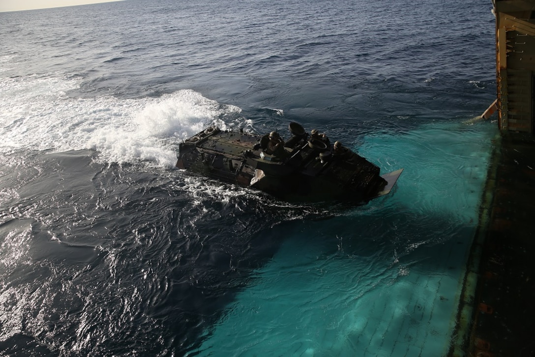 An Assault Amphibious Vehicle  embarks on the USS Essex (LHD 2) off the shore of Camp Pendleton Feb. 23, 2016. Once aboard the ship, the AAV-7s staged for the start of a Marine Corps Readiness Evaluation, which prepares Company A, 3rd Assault Amphibian Battalion for its upcoming deployment to Okinawa, Japan. (U.S. Marine Corps photo by Lance Cpl. Timothy Valero/Released)