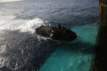 An Assault Amphibious Vehicle  embarks on the USS Essex (LHD 2) off the shore of Camp Pendleton Feb. 23, 2016. Once aboard the ship, the AAV-7s staged for the start of a Marine Corps Readiness Evaluation, which prepares Company A, 3rd Assault Amphibian Battalion for its upcoming deployment to Okinawa, Japan. (U.S. Marine Corps photo by Lance Cpl. Timothy Valero/Released)
