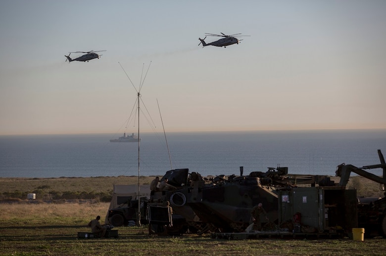 Marines conduct maintenance on Amphibious Assault Vehicles during a Marine Corps Combat Readiness Evaluation Feb. 24, 2016. The MCCRE evaluates the readiness of the Marines of Company A, 3rd Assault Amphibian Battalion prior to their deployment to Okinawa, Japan. During the MCCRE, Marines were supported by the USS Essex (LHD 2) and the 3rd Marine Aircraft Wing to provide a realistic training environment. (U.S. Marine Corps photo by Lance Cpl. Timothy Valero/ Released)