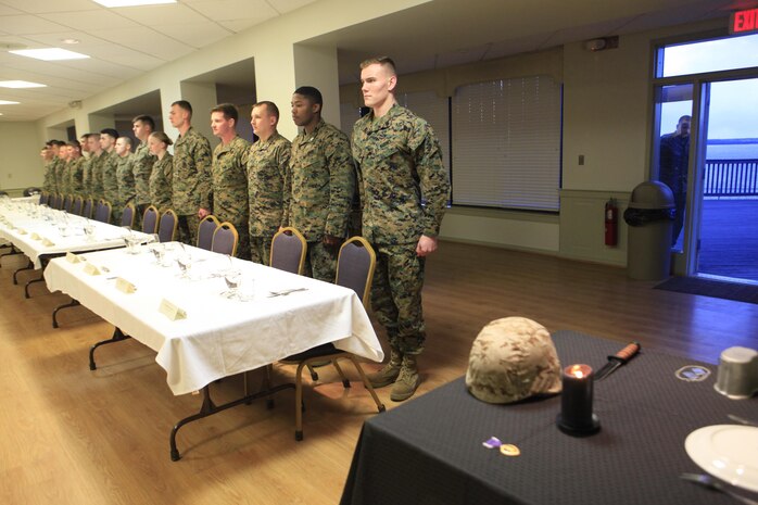 Students and instructors of a Chemical Biological Incident Response Force (CBIRF) Command Sponsored Corporals Course stand at attention as they wait for the head table to march in during a Mess Night at the Mix House aboard Naval Support Facility Indian Head, Md., Feb. 25, 2016. Corporals with CBIRF, U.S. Marine Forces Command (MARFORCOM), participated in the time-honored tradition of a Marine Corps Mess night with guest of honor Sgt. Maj. Robert G. VanOostrom, sergeant major of manpower and reserve affairs, the night prior to their graduation from the course. The noncommissioned officers completed the 3 week course curriculum that included sword and guidon manual, land navigation, Marine Corps promotion system for sergeants and below and other small unit leader skills and traits. (Official USMC Photos by Sgt. Santiago G. Colon Jr./Released)
