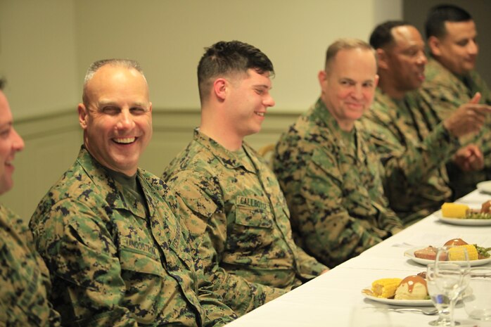 Sgt. Maj. Robert G. VanOostrom, the sergeant major of manpower and reserve affairs (second from left), shares a laugh with Gunnery Sgt. Geoffrey A. Kruse, Corporals Course lead instructor and native of Bates City, Mo., during a Mess Night at the Mix House aboard Naval Support Facility Indian Head, Md., Feb. 25, 2016. Corporals with Chemical Biological Incident Response Force (CBIRF), U.S. Marine Forces Command (MARFORCOM) participated in the time-honored tradition of a Marine Corps Mess night with guest of honor VanOostrom, the night prior to their graduation from Command Sponsored Corporals Course. The noncommissioned officers completed the 3 week course curriculum that included sword and guidon manual, land navigation, Marine Corps promotion system for sergeants and below and other small unit leader skills and traits. (Official USMC Photos by Sgt. Santiago G. Colon Jr./Released)
