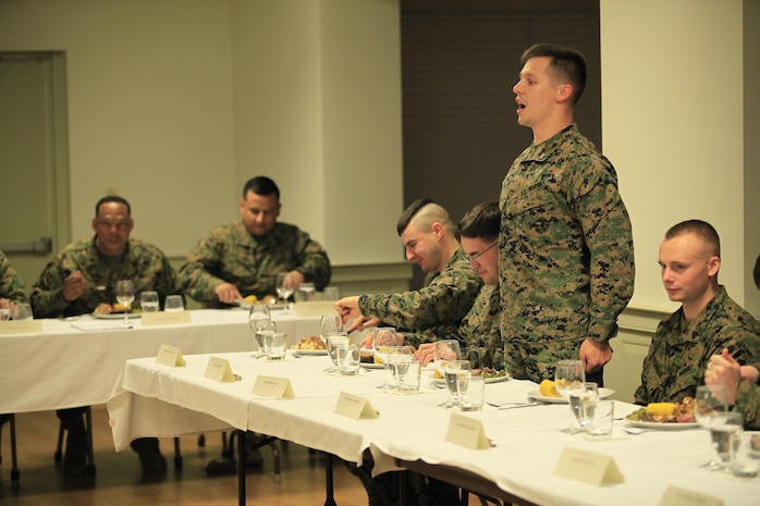 Lake Orion, Miss.- native Cpl. Demetri X. Duey, a rescue man with Reaction Force Company, Chemical Biological Incident Response Force (CBIRF), address the Vice-President of the Mess during a Mess Night at the Mix House aboard Naval Support Facility Indian Head, Md., Feb. 25, 2016. Corporals with CBIRF, U.S. Marine Forces Command (MARFORCOM), participated in the time-honored tradition of a Marine Corps Mess night with guest of honor Sgt. Maj. Robert G. VanOostrom, sergeant major of manpower and reserve affairs, the night prior to their graduation from the course. The noncommissioned officers completed the 3 week course curriculum that included sword and guidon manual, land navigation, Marine Corps promotion system for sergeants and below and other small unit leader skills and traits. (Official USMC Photos by Sgt. Santiago G. Colon Jr./Released)
