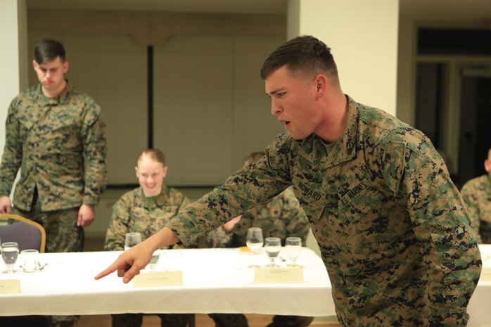 Plant City, Fla.- native Cpl. Justin A. Howard, a team member with Technical Rescue Platoon, React Force Company, Chemical Biological Incident Response Force (CBIRF), impersonates an instructor as part of a skit during a Mess Night at the Mix House aboard Naval Support Facility Indian Head, Md., Feb. 25, 2016. Corporals with CBIRF, U.S. Marine Forces Command (MARFORCOM), participated in the time-honored tradition of a Marine Corps Mess night with guest of honor Sgt. Maj. Robert G. VanOostrom, sergeant major of manpower and reserve affairs, the night prior to their graduation from the course. The noncommissioned officers completed the 3 week course curriculum that included sword and guidon manual, land navigation, Marine Corps promotion system for sergeants and below and other small unit leader skills and traits. (Official USMC Photos by Sgt. Santiago G. Colon Jr./Released)
