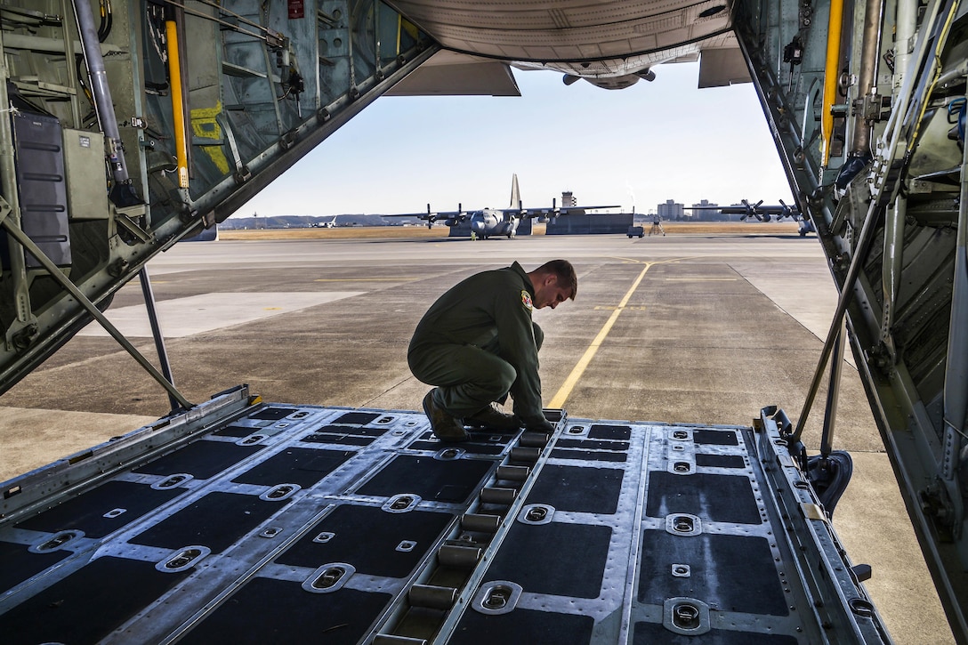 Air Force Senior Airman Christopher Hofer performs a preflight inspection on an aircraft on Yokota Air Base, Japan, March 2, 2016. Hofer is a loadmaster assigned to the 374th Operations Support Squadron. Air Force photo by Senior Airman David Owsianka