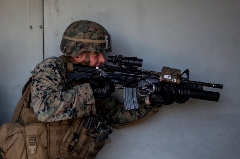 Lance Cpl. Parker Chase gets into position as the point man in his fire team during combat marksmanship training at Camp Pendleton March 2, 2016. The training was part of the Urban Leaders Course taught by 1st Marine Division Schools. The course focuses on enhancing small unit leadership through integrated training and implementation of fire teams and squad-sized elements in an urban setting. Chase is a rifleman with 2nd Battalion, 5th Marine Regiment, 1st Mar. Div., and a Harwich, Massachusetts native.  (U.S.  Marine Corps photo by Sgt. Emmanuel Ramos/Released)