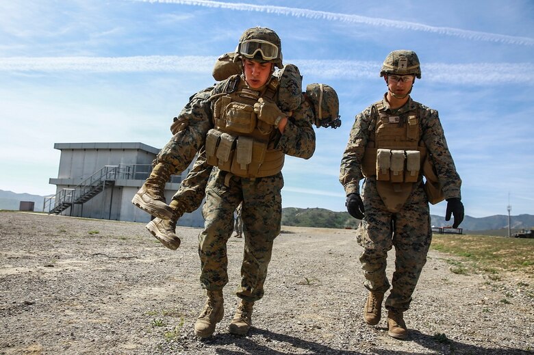 Marines execute a casualty evacuation drill during combat marksmanship training at Camp Pendleton March 2, 2016. The training was part of the Urban Leaders Course taught by 1st Marine Division Schools. The course focuses on enhancing small unit leadership through integrated training and implementation of fire teams and squad-sized elements in an urban setting. Marines participating in the training are from various units on Camp Pendleton. (U.S.  Marine Corps photo by Sgt. Emmanuel Ramos/Released)