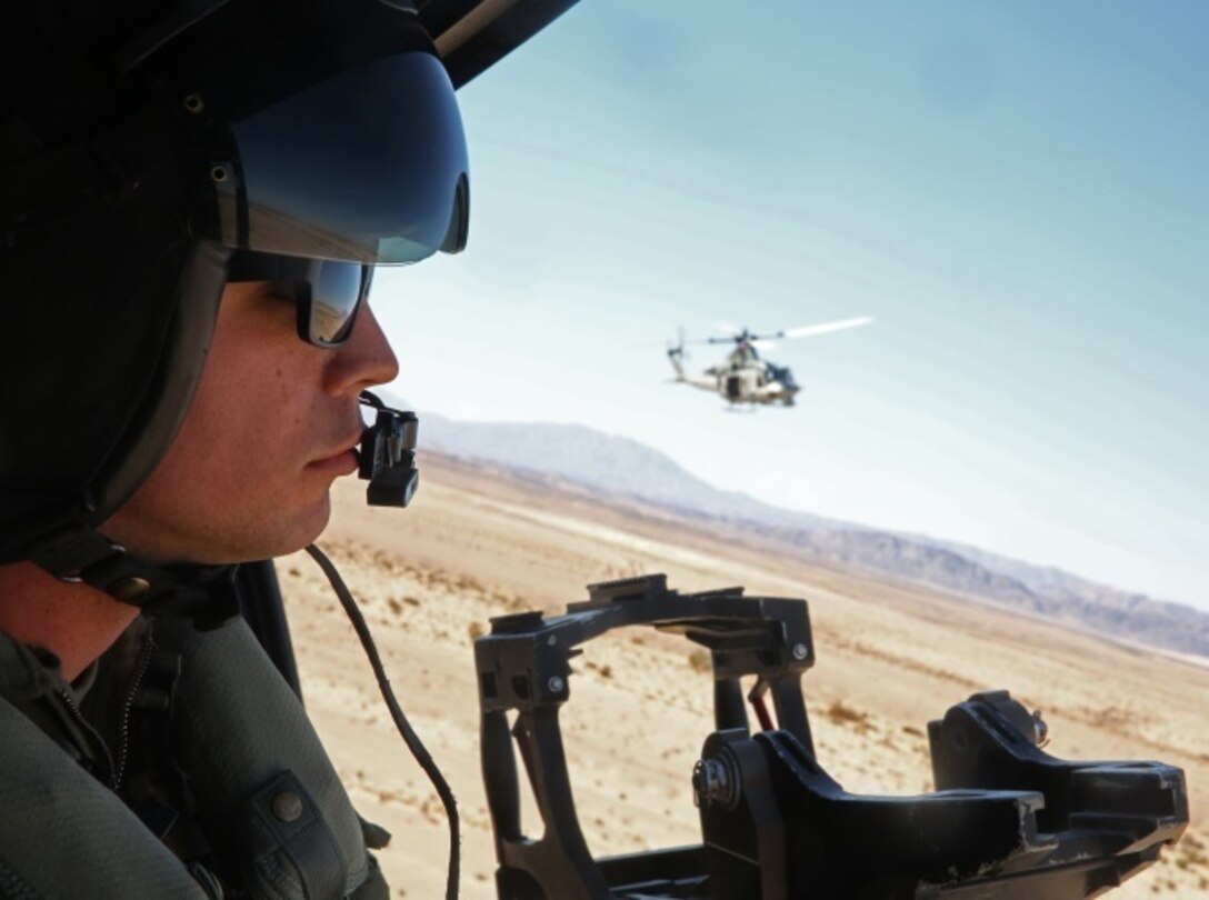 Lance Cpl. Gerald J. Demontmollin III scans the area for targets inside of a UH-1Y Venom Feb. 24, 2016, at Camp Pendleton. Demontmollin and his squadron performed simulated assault and close air support training to maintain unit readiness. Demontmollin, from Grass Valley, is a crew chief with Marine Light Attack Helicopter Squadron 169, Marine Aircraft Group 39, 3rd Marine Air Wing.  (U.S. Marine Corps photo by Lance Cpl. Justin E. Bowles)
