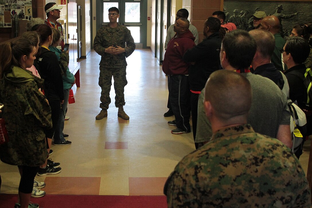 Educators receive a brief from Sgt. Kenneth R. Clinton, a Marksmanship Coach, before they enter the the indoor simulated marksmanship trainer (ISMT) March 2, 2016, aboard Marine Corps Recruit Depot Parris Island, S.C. The ISMT's purpose is to prepare the users with service rifles for live fire on a range. The educators are from the greater Atlanta, Ga., and Columbia, S.C., areas. (Official Marine Corps photo by Cpl. Diamond N. Peden/Released)