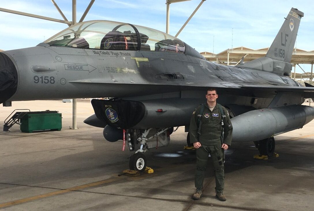 Capt. Quinton Keigley, 14th Medical Operations Squadron, pauses before an F-16 Fighting Falcon sortie on the flightline at Luke Air Force Base, Arizona. Keigley is attending Top Knife II at Luke where flight surgeons and physiologists spend two weeks in academics, simulators and high “G” flight to better understand the effect of high “G” aircraft on aircrew members. Keigley was just recognized as the 2015 AETC Flight Surgeon of the Year. (U.S. Air Force photo) 