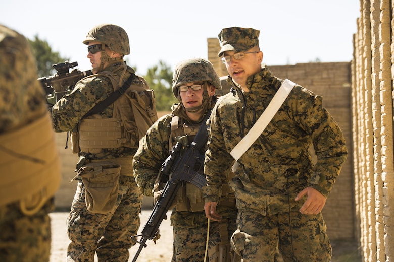 Lance Cpl. Christopher A. Garcia (center), a military policeman for Bravo Company, 2nd Law Enforcement Battalion, escorts a high-valued target during Tactical Site Exploitation training at Camp Lejeune, N.C., March 3, 2016. The unit conducts TSE to ensure their Marines maintain peak proficiency in standard operating procedures when handling enemy criminal evidence. (U.S. Marine Corps photo by Lance Cpl. Samuel Guerra/Released)