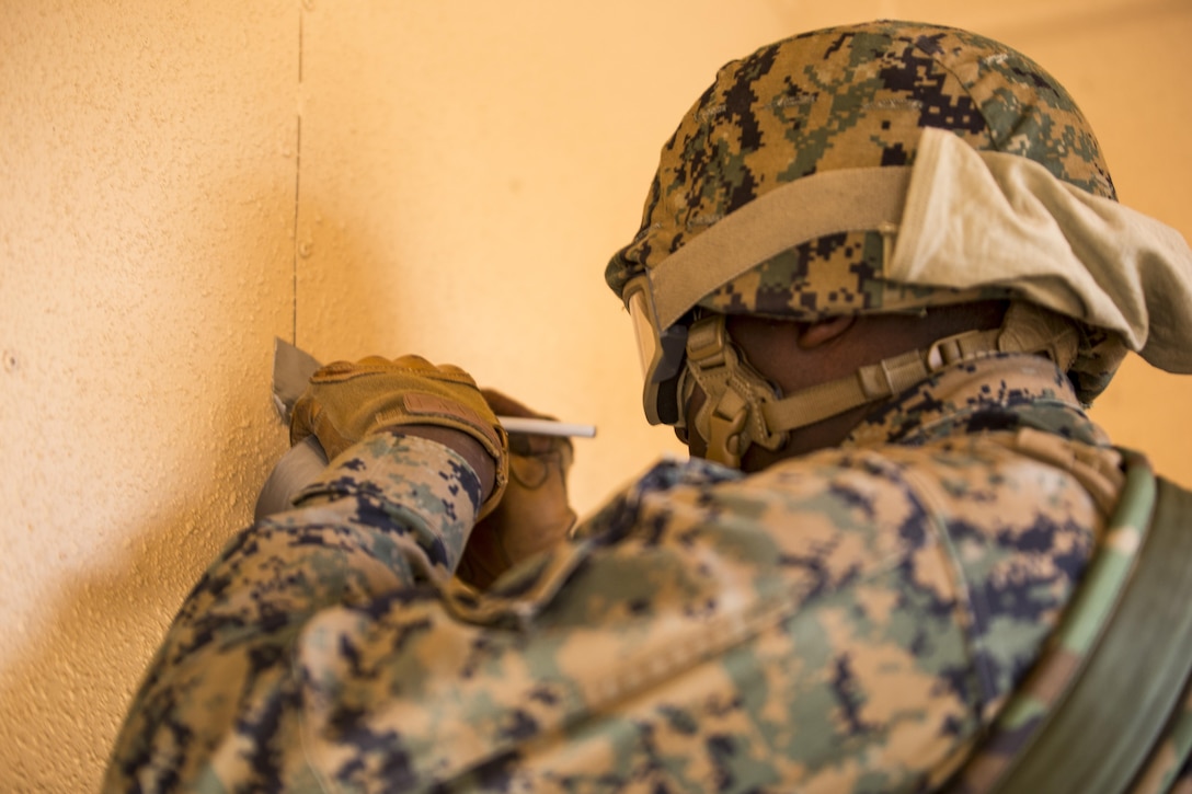 Lance Cpl. Christopher Tory, military policeman for Bravo Company, 2nd Law Enforcement Battalion, numbers locations where evidence is prominent during Tactical Site Exploitation training at Camp Lejeune, N.C., March 3, 2016. The training ensures the Marines utilize proper criminal investigation techniques to analyze evidence and collect data to prosecute enemy suspects. (U.S. Marine Corps photo by Lance Cpl. Samuel Guerra/Released)
