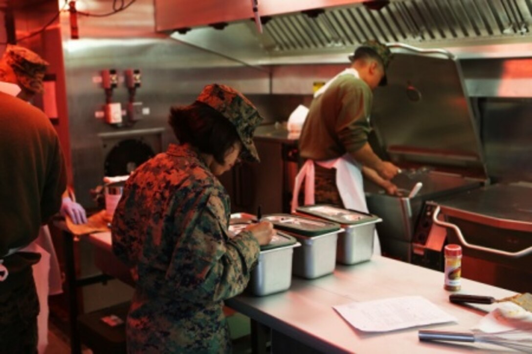 Sgt. Cindy Argueta, a chief cook with Food Service Company, Headquarters Regiment, 1st Marine Logistics Group, creates information cards for a meal that will be graded and judged by representatives from Headquarters Marine Corps and the National Restaurant Association in competition for the Maj. General William Pendleton Thompson Hill Memorial award in the field mess category aboard Camp Pendleton, Calif., Feb. 22, 2016. Marines with 1st MLG competed against the other major subordinate commands in the region and earned the opportunity to be evaluated against field mess representatives from the East Coast and Okinawa, Japan.