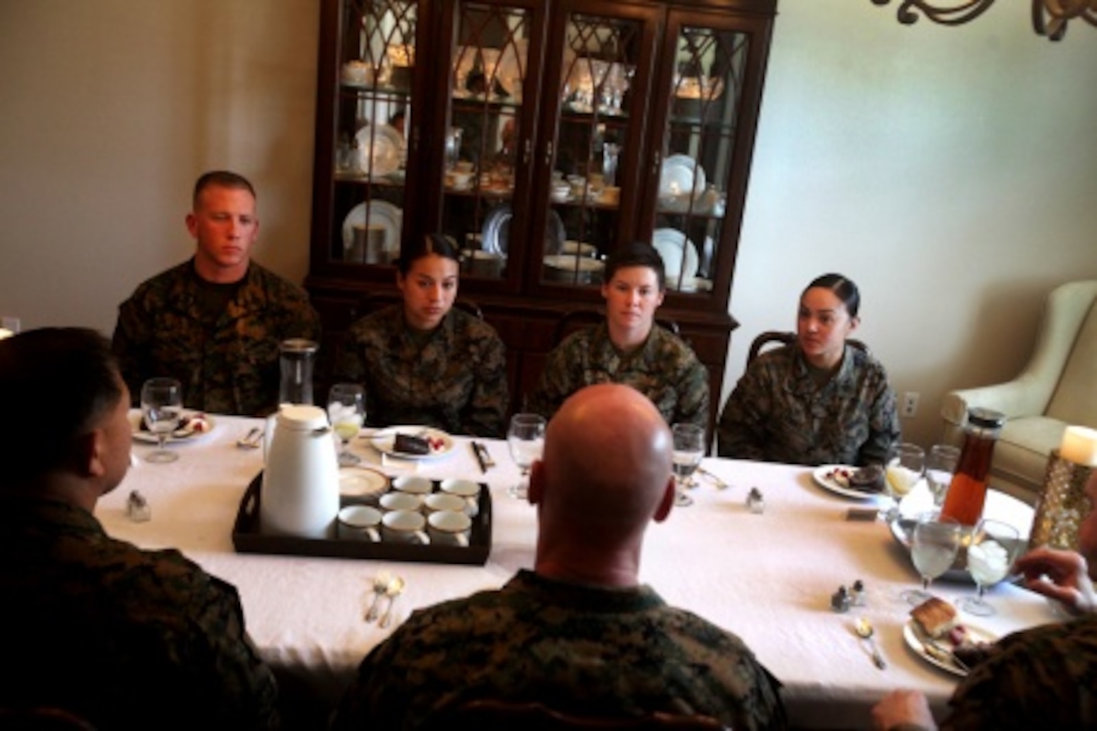 Brigadier Gen. David A. Ottignon, the 1st Marine Logistics Group commanding general, Master Chief Petty Officer Harlan B. Patawaran, the command master chief of 1st MLG, and Sgt. Maj. Troy E. Black, the sergeant major of 1st MLG, share lunch with meritoriously promoted sergeants aboard Camp Pendleton, Calif., Feb. 23, 2016. The gathering served as an ideal opportunity for the four meritoriously promoted sergeants to draw on the leaders’ knowledge and experience through discussions of leadership, work ethic, family life, and what it means to be a sergeant of Marines. The four Marines promoted included Sgt. Casey Primeaux, a combat engineer with 7th Engineer Support Battalion, Sgt. Nadia Gonzalezdiez, a food service specialist with Food Service Company, Headquarters Regiment, Sgt. Ryan Langham, a communications maintenance technician with Combat Logistics Battalion 5, and Sgt. Tyrose Lawas, a warehouse clerk with Combat Logistics Regiment 15, all under 1st MLG.