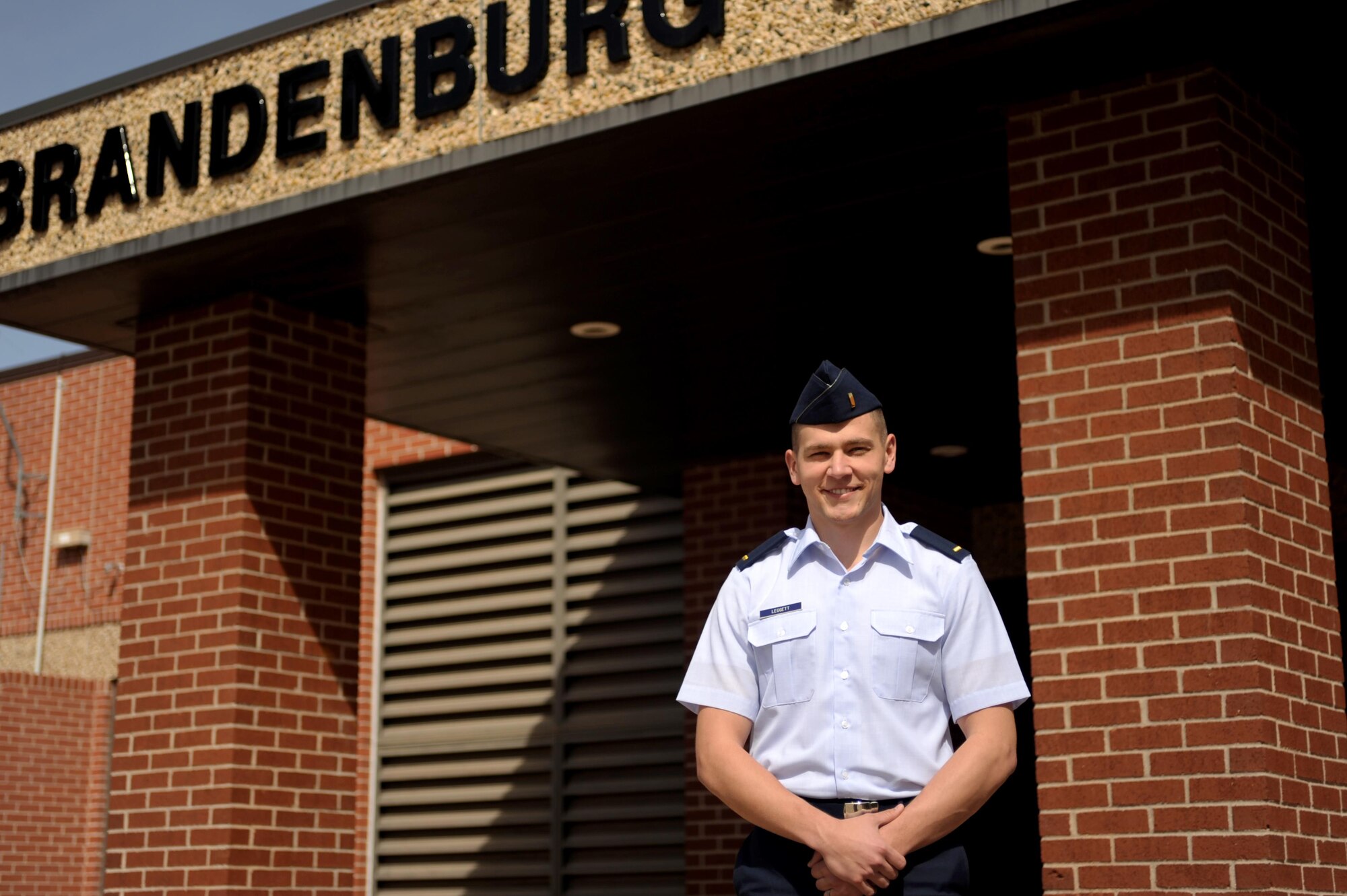 U.S. Air Force 2nd Lt. Kyle A. Leggett, 315th Training Squadron student, smiles for a portrait in front of Brandenburg Hall on Goodfellow Air Force Base, Texas, March 4, 2016. Leggett is the Goodfellow Student of the Month spotlight for February, a series highlighting Team Goodfellow students. (U.S. Air Force photo by Senior Airman Joshua Edwards/Released)