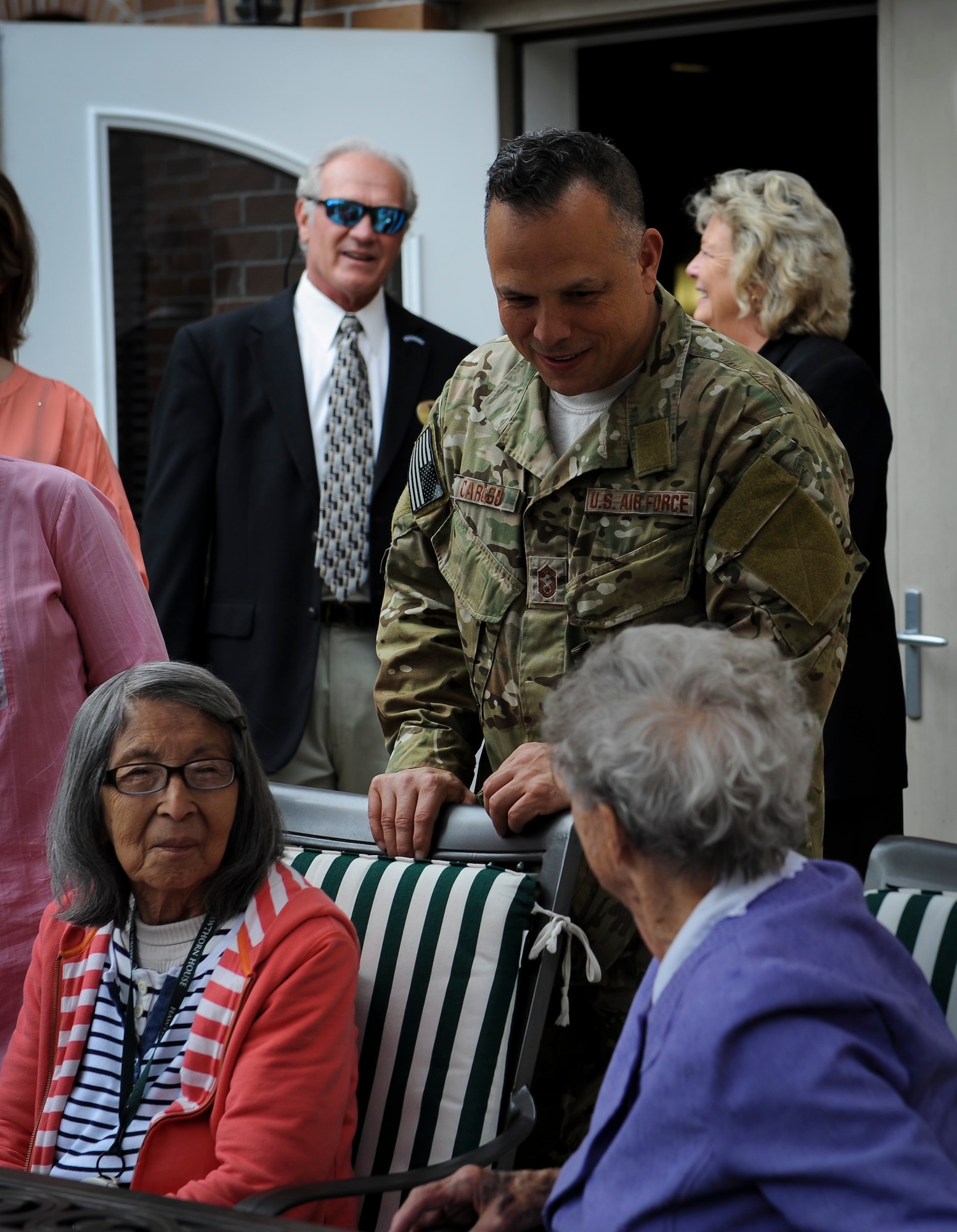 Chief Master Sgt. Matt Caruso, command chief of Air Force Special Operations Command, speaks with a resident at the Hawthorn House during a visit to the Air Force Enlisted Village in Shalimar, Fla., March. 1, 2016. The AFEV is a nonprofit organization whose core mission is to provide a safe, secure home for surviving spouses of retired enlisted U.S. Airmen and is one of four charities included in the Air Force Assistance Fund campaign.  The AFSOC AFAF campaign will run from March 21 - April 29. (U.S. Air Force photo by Senior Airman Meagan Schutter)