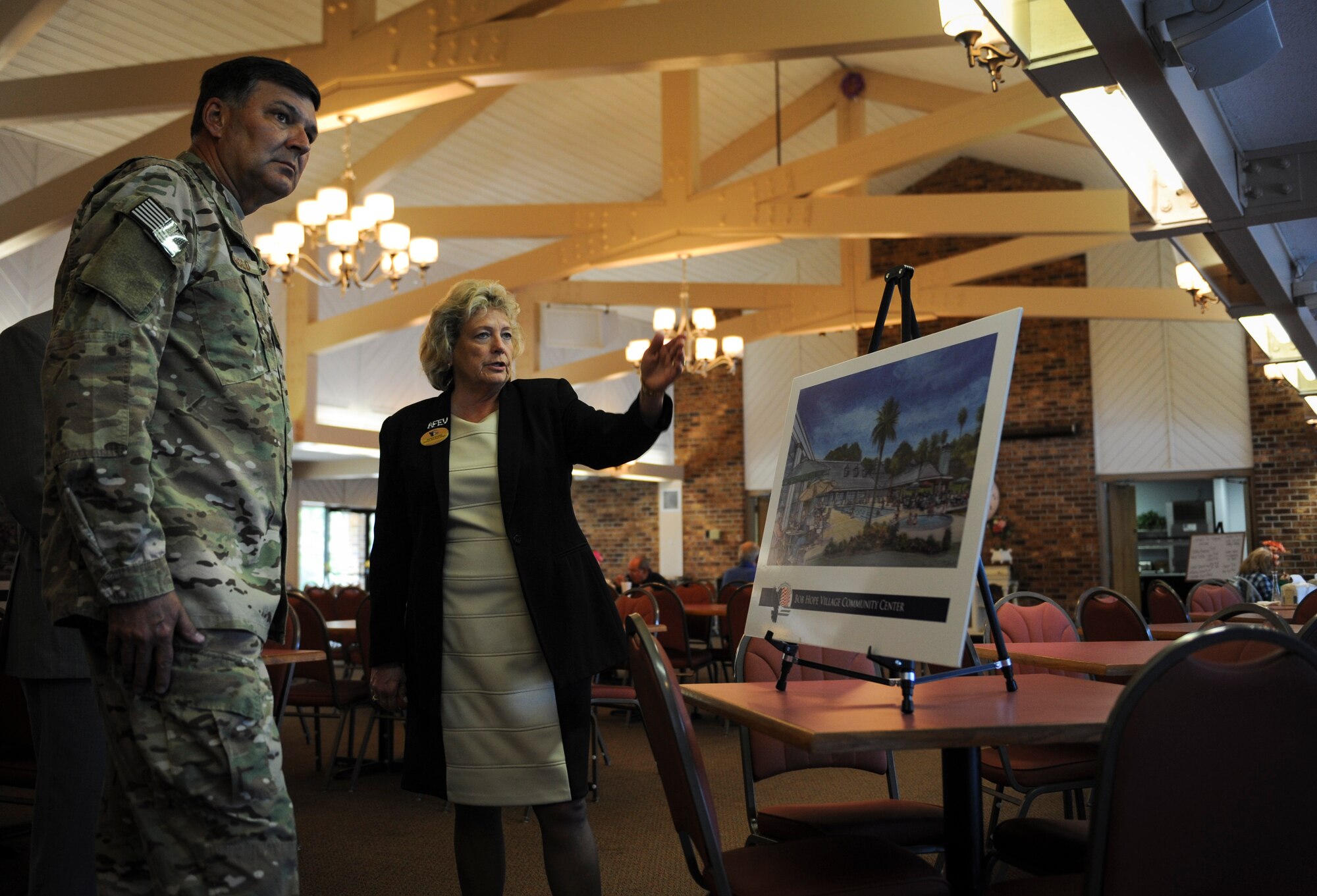 Lt. Gen. Brad Heithold, commander of Air Force Special Operations Command, speaks with Sharon Behnke, director of Bob Hope Village at the Air Force Enlisted Village, Shalimar, Fla., March. 1, 2016. The AFEV is a nonprofit organization whose core mission is to provide a safe, secure home for surviving spouses of retired enlisted U.S. Airmen and is one of four charities included in the Air Force Assistance Fund campaign.  The AFSOC AFAF campaign will run from March 21 - April 29. (U.S. Air Force photo by Senior Airman Meagan Schutter)