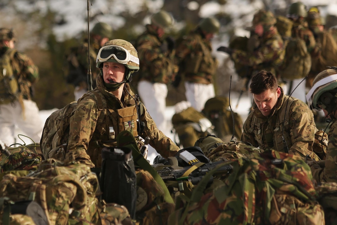 U.S. Marines and Dutch, British and Norwegian troops perform an integrated air insertion during Exercise Cold Response 16 near Namsos, Norway, March 3, 2016. The exercise aims to challenge the integration of air, land and sea capabilities of 13 NATO allies and partners while improving their collective capacity to respond and operate as a team. Marine Corps photo by Master Sgt. Chad McMeen
