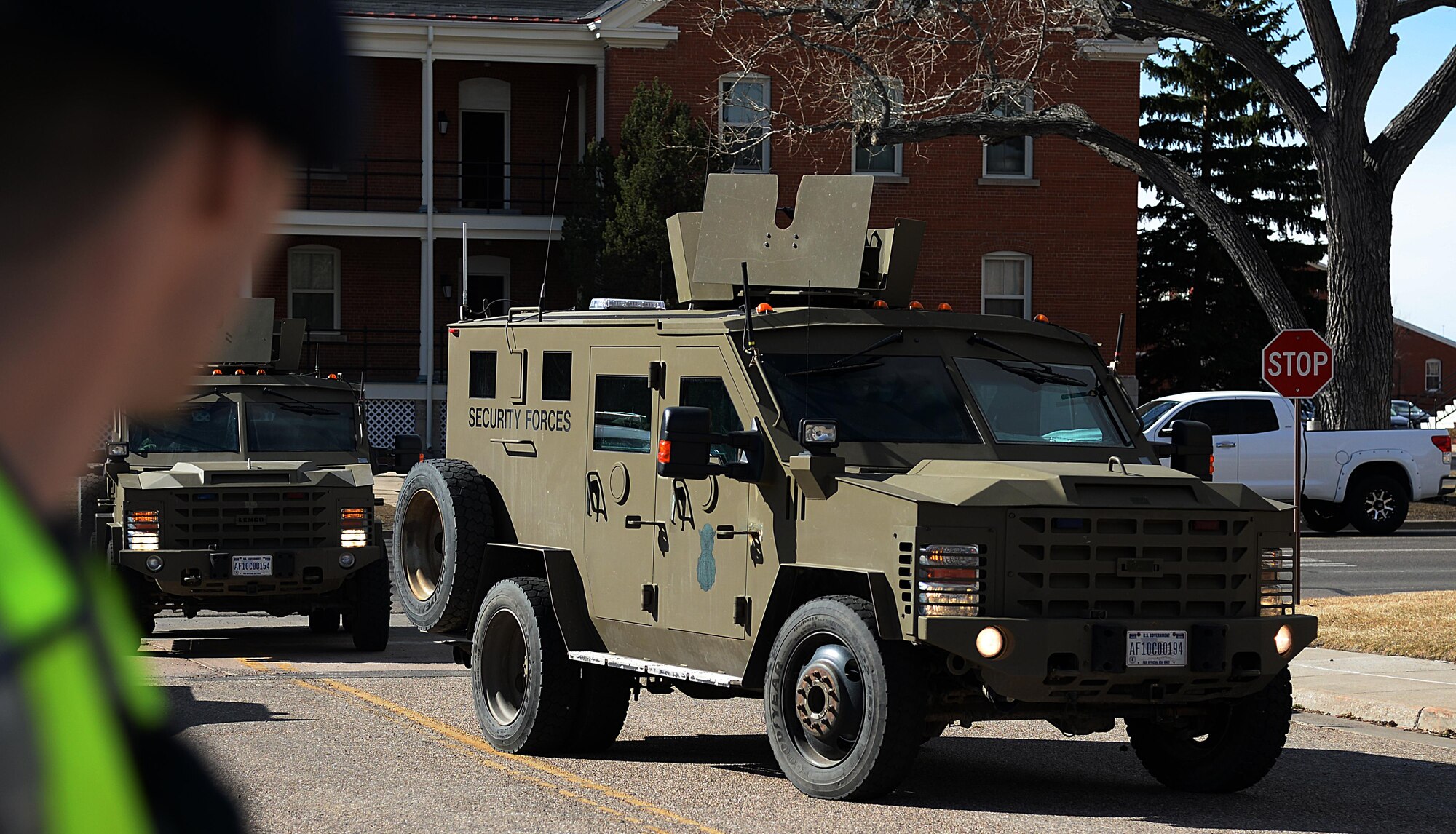An evaluator looks on as the 790th Missile Security Forces Squadron Tactical Response Force arrives at the base theater on F.E. Warren Air Force Base, Wyo., Feb. 29, 2016, during an active shooter exercise. The TRF unit was responsible for verifying the theater was secure after the staged incident was almost completed. (U.S. Air Force photo by Airman 1st Class Malcolm Mayfield)