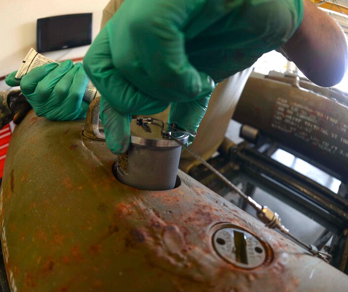 Staff Sgt. Anthony, 432nd Maintenance Squadron munitions flight crew chief, inserts a fuse into the GBU-12 Paveway II laser-guided bomb March 1, 2016 at Creech Air Force Base, Nevada. The flight oversees and accounts for a $14 million stockpile consisting of about 70,000 pounds of explosive weight. (U.S. Air Force photo by Airman 1st Class Kristan Campbell/Released)