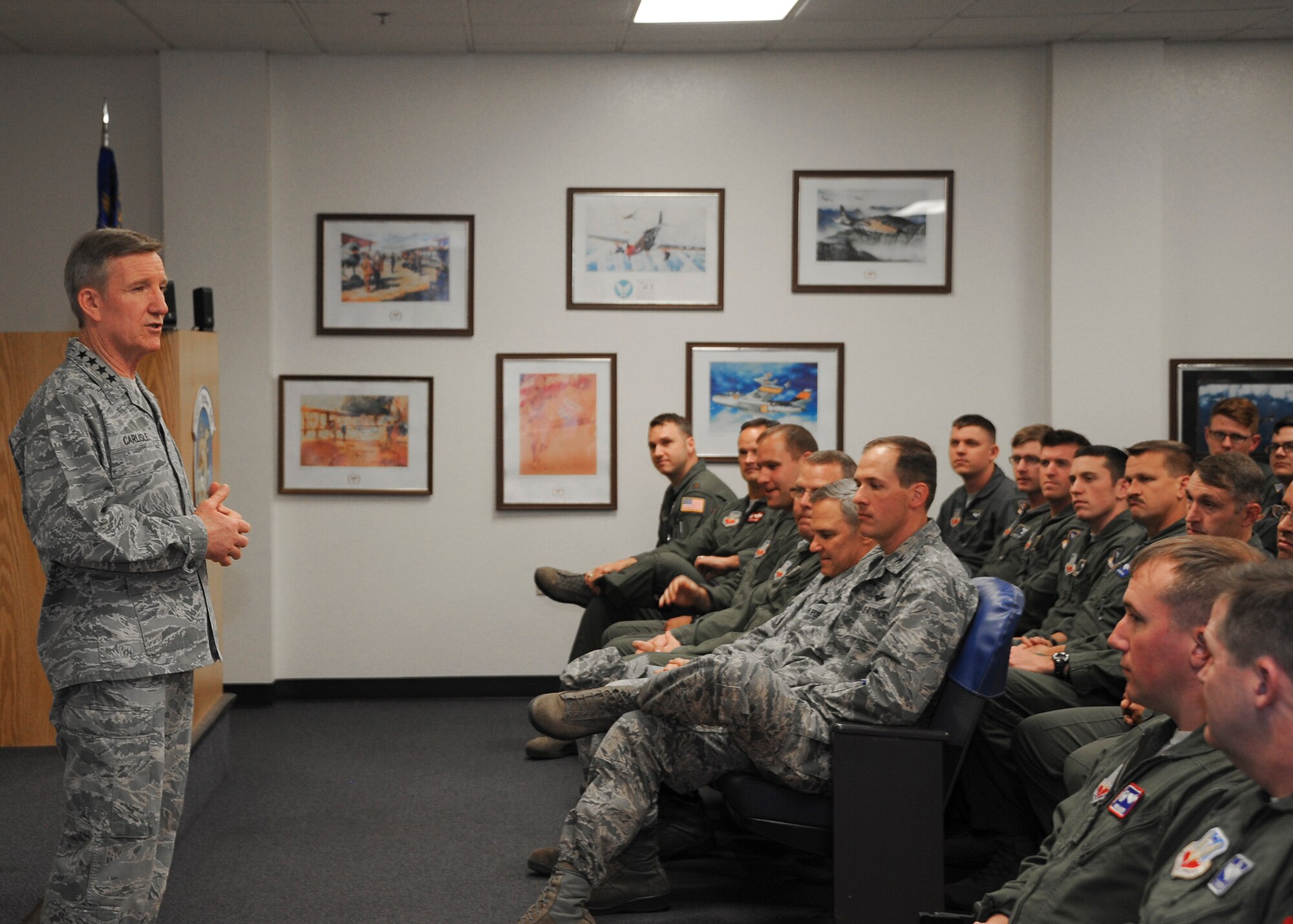 U.S. Air Force Gen. Hawk Carlisle, commander of Air Combat Command, briefs 354th Fighter Squadron aircrew Airmen at Davis-Monthan Air Force Base, Ariz., March 3, 2016. Carlisle spoke about the importance of integrating young pilots into flying squadrons and the significance each individual makes to the Air Force. Carlisle is responsible for organizing, training, equipping and maintaining combat-ready forces for rapid deployment and employment while ensuring strategic air defense forces are ready to meet the challenges of peacetime air sovereignty and wartime defense. (U.S. Air Force photo by Airman 1st Class Ashley N. Steffen/ Released)