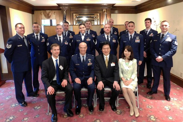 Airmen from Joint Base Lewis-McChord, Wash., including members from the 446th & 62nd Airlift Wing's, and the Western Air Defense Sector, participate in a group photo with the Consulate General of Japan Masahiro Omura, and his wife during his Tomodachi Reception in Seattle Feb. 19, 2016. Nearly 20 Airmen attended the lunch, due to their experiences when they were stationed in Japan, or participated in an exercise or operation with the Japanese, which helped strengthen the bilateral relationship. Tomodachi is the Japanese translation for "friendship." (Courtesy photo/Consulate General of Japan, Seattle)