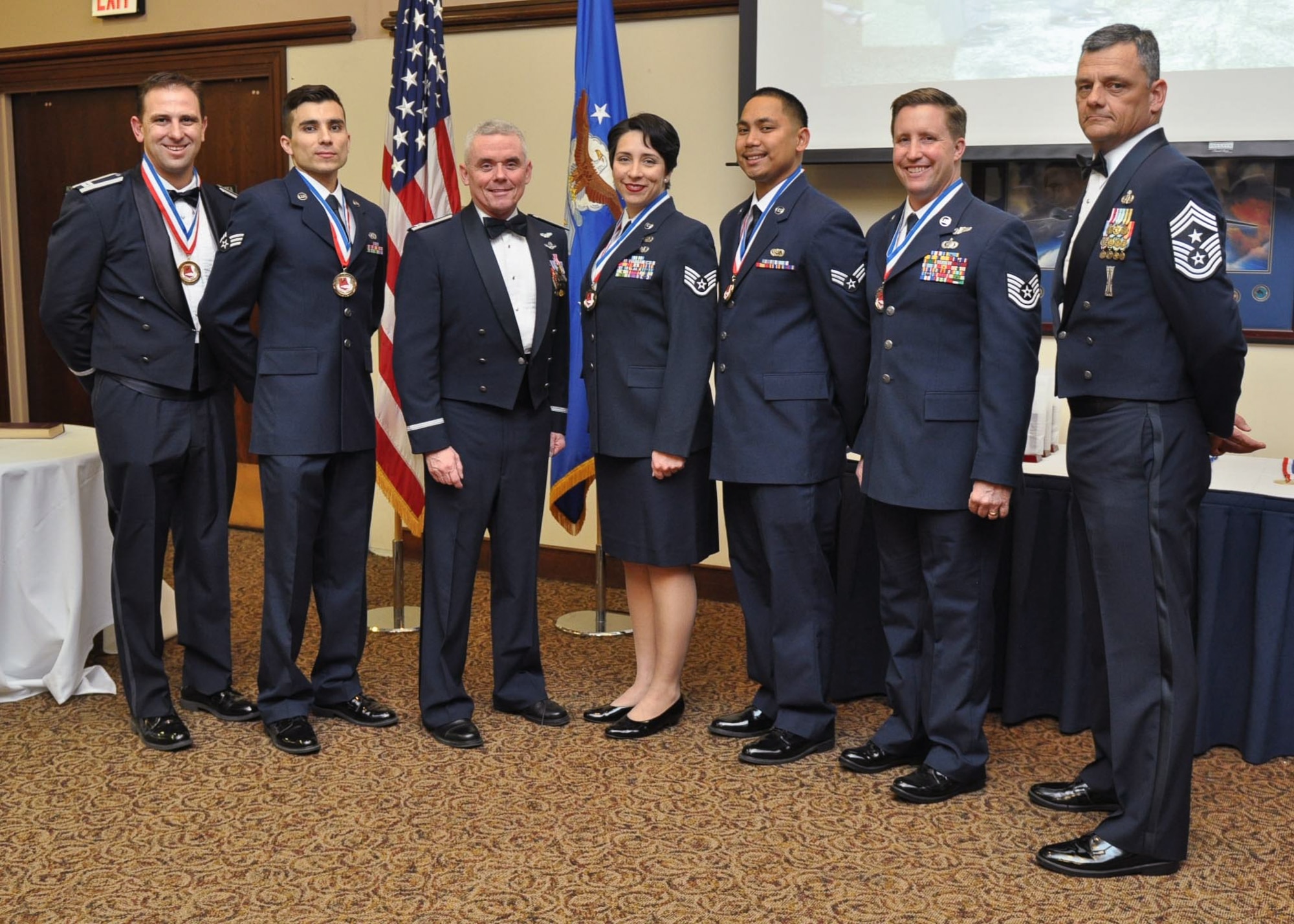 Col. John Trnka, 940th Wing Commander and Chief Master Sgt. Denny Brown, 940th Wing Command Chief pose for a photo with the 2015 940th Wing Annual Award nominees and winners at the 940th Wing Dining Out and Annual Awards Banquet. The Annual Awards portion of the evening recognized all the nominees and winners as the wing's top performers throughout the year. (U.S. Air Force Photo/ Tech. Sgt. Heather Skinkle)
