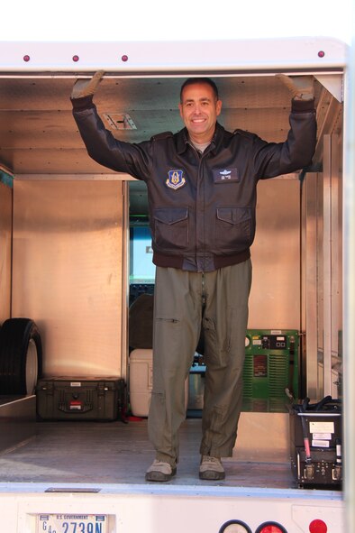 Chief Master Sgt. Jose Tamayo smiles as he helps his 932nd Aeromedical Evacuation Squadron team load a transport truck and head out to the waiting C-130 airplane during the recent drill weekend.  Chief Tamayo is retiring soon and closing the door on the Air Force Reserve side of his productive career.  His retirement will take place on Sunday, March 6, at 10:30 a.m. inside the Scott Club, Scott Air Force Base, Ill.  (U.S. Air Force photo by Maj. Stan Paregien)
