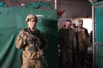 A soldier provides security while Marine Corps Gen. Joseph F. Dunford Jr., chairman of the Joint Chiefs of Staff, center, and Army Brig. Gen. Michael Howard walk around on Forward Operating Base Fenty in Jalalabad, Afghanistan, March 2, 2016. DoD photo by D. Myles Cullen