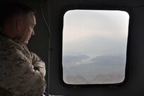 Marine Corps Gen. Joseph F. Dunford Jr., chairman of the Joint Chiefs of Staff, looks outside a UH-60 Black Hawk helicopter while flying over Eastern Afghanistan, March 2, 2016. DoD photo by D. Myles Cullen
