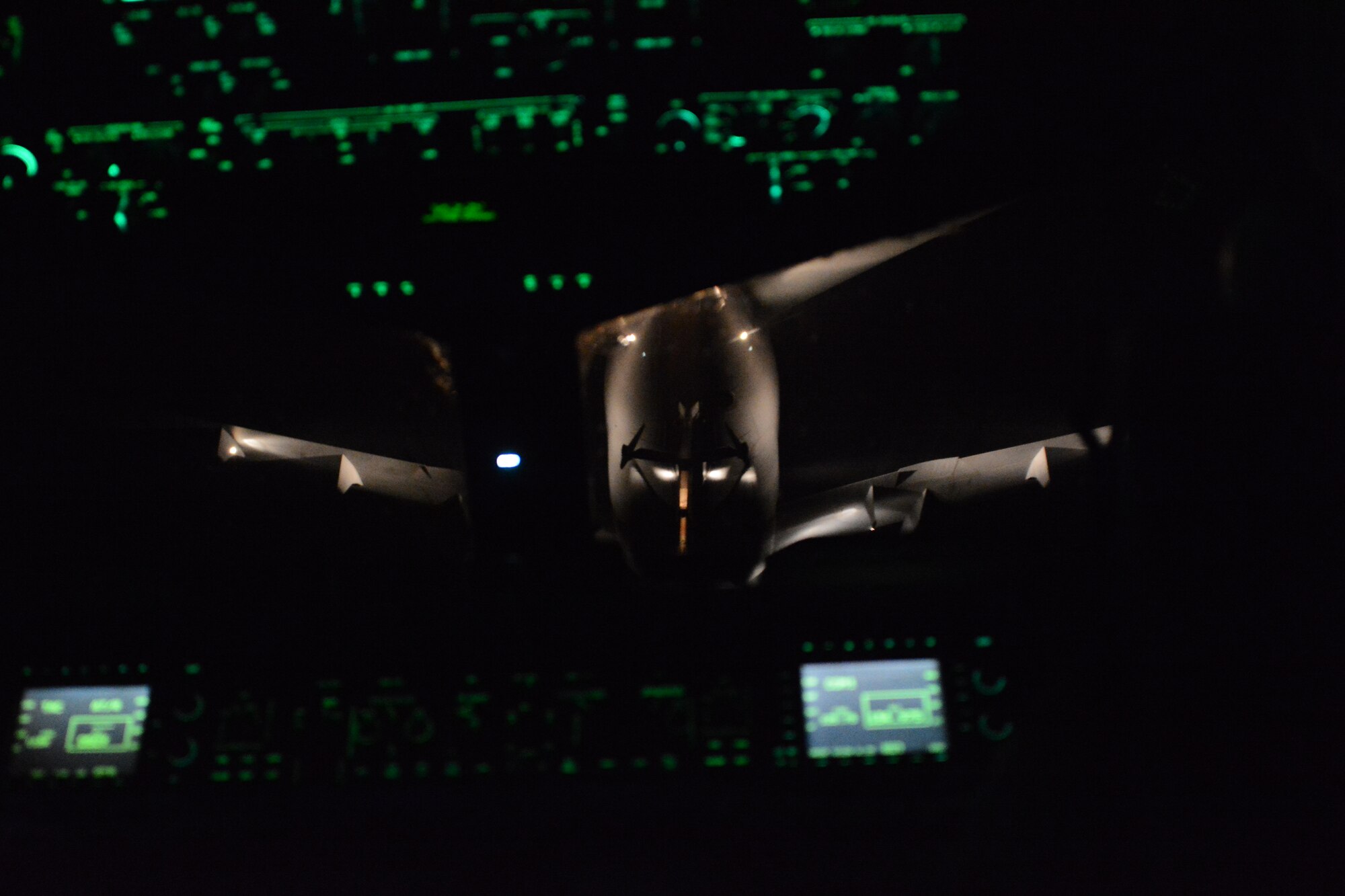 A Travis Air Force Base, California, KC-10 Extender positions itself above a C-17 Globemaster III March 2 for a late-night aerial refuel. The refuel was part of the night training for the C-17 pilots. (U.S. Air Force photo by Airman 1st Class Amber Carter) 