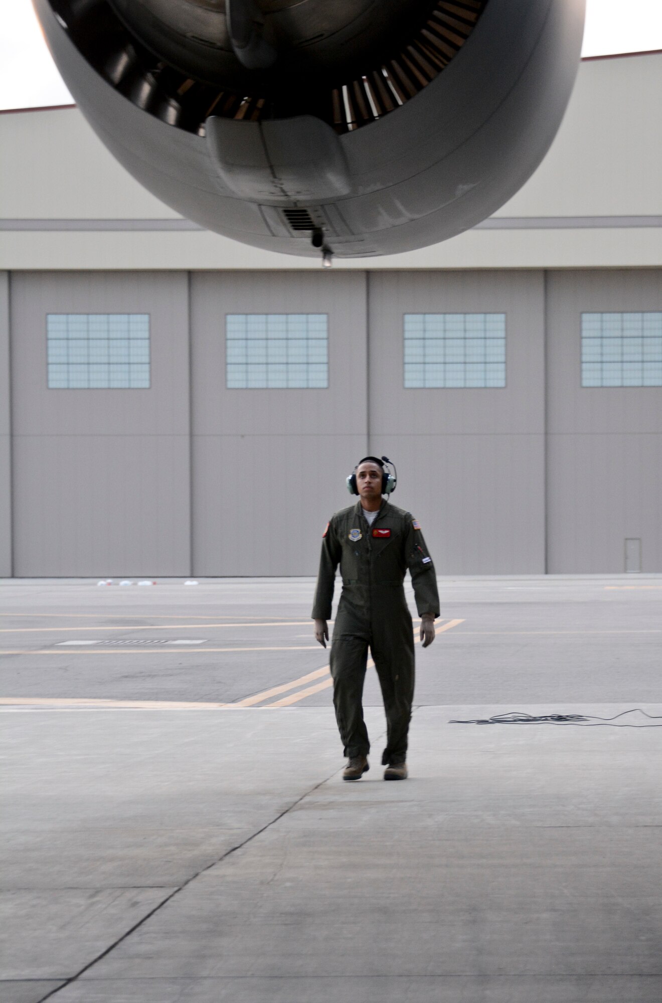 Capt. Dante Earle, 21st Airlift Squadron instructor pilot, inspects his C-17 Globemaster III before takeoff March 2 at Travis Air Force Base, California. Earle trained two pilots during the flight. (U.S. Air Force photo by Airman 1st Class Amber Carter) 