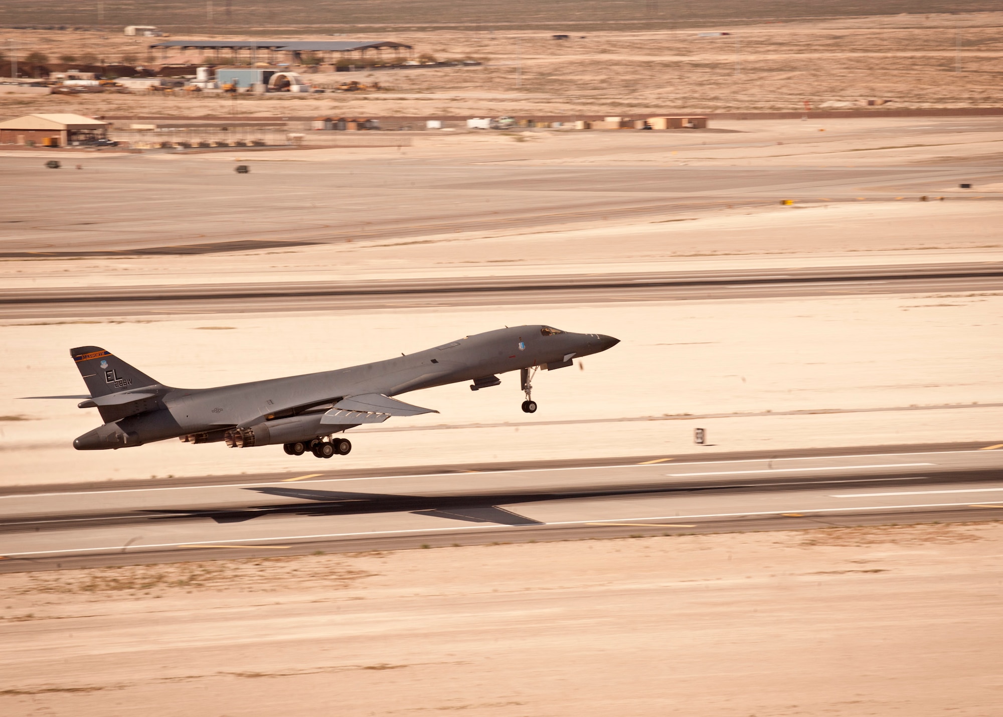 A B-1 bomber takes off to play its role in a Red Flag 16-2 training sortie at Nellis Air Force Base, Nev., March 3, 2016. Just northwest of Nellis lies the 2.9 million-square-acre Nevada test and Training Range which provides a realistic arena for operational testing and training aircrews to improve combat readiness. (U.S. Air Force photo by Senior Airman Joshua Kleinholz)