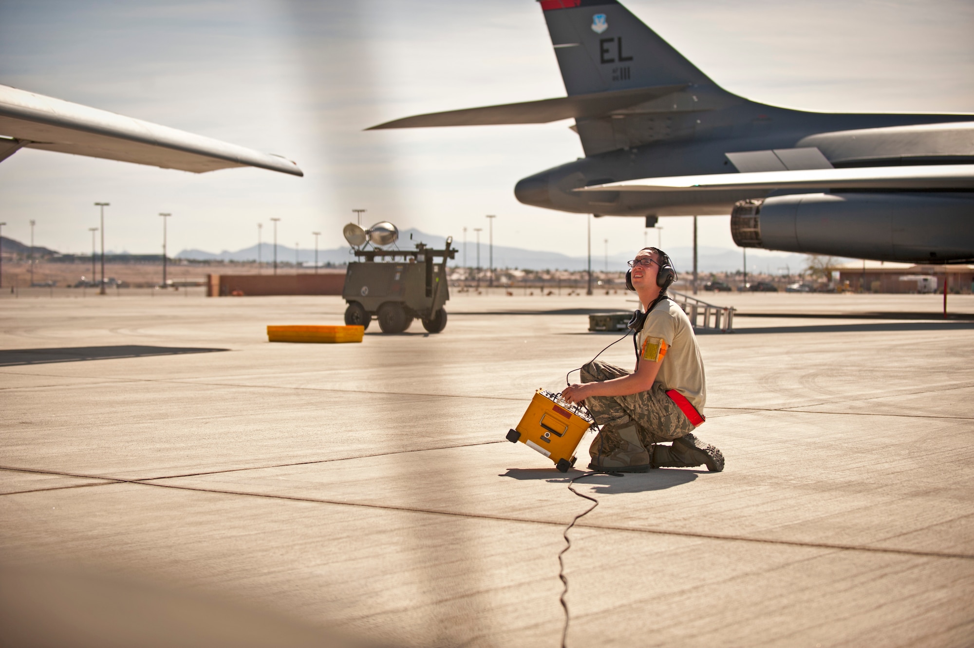 Senior Airman Roger Stitt, Defensive Avionics Technician assigned to the 28th Aircraft Maintenance Squadron, performs pre-flight checks on a B-1 bomber prior to a Red Flag 16-2 training sortie at Nellis Air Force Base, Nev., March 3, 2016. Red Flag provides realistic combat training in a contested, degraded and operationally-limited environment, which provides aircrews with real-time war scenarios and helps ground crews test and improve their operational readiness. (U.S. Air Force photo by Senior Airman Joshua Kleinholz)