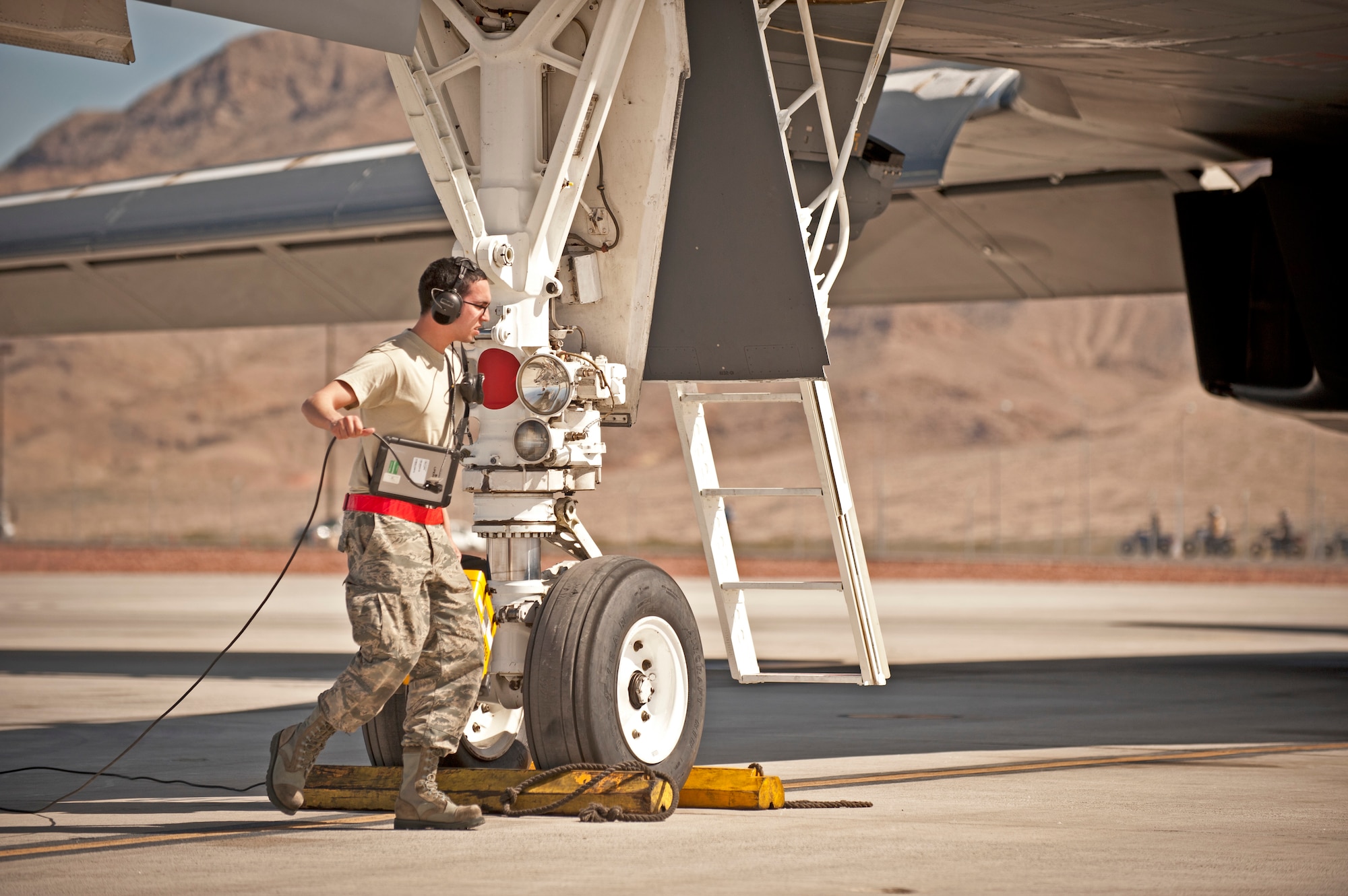 Senior Airman Roger Stitt, Defensive Avionics Technician assigned to the 28th Aircraft Maintenance Squadron, performs pre-flight checks on a B-1 bomber prior to a Red Flag 16-2 training sortie at Nellis Air Force Base, Nev., March 3, 2016. Red Flag involves a series of intense air-to-air combat exercises designed to prepare U.S. and allied forces for future real world conflicts. (U.S. Air Force photo by Senior Airman Joshua Kleinholz)