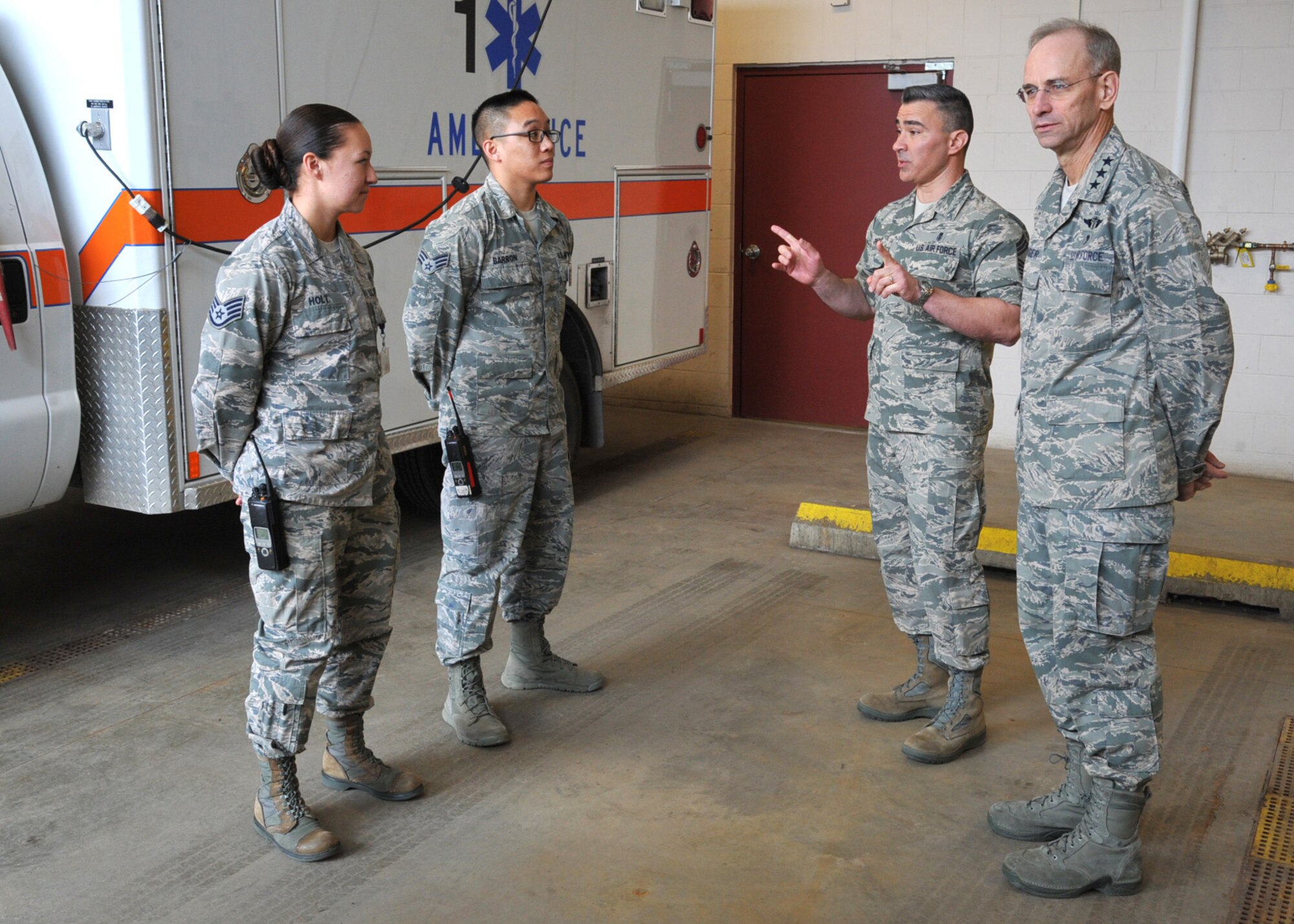 Air Force Surgeon General Lt. Gen. (Dr.)  Gen. Mark Ediger, right, and Chief Master Sgt. Jason Pace, middle, chief medical enlisted force and enlisted corps chief, speak with Airmen from the 319th Medical Group March 4, 2016, on Grand Forks Air Force Base, N.D. General Ediger and Chief Pace received a tour of the medical facilities and recognized the many 2015 award winners from the 319th Medical Group. (U.S. Air Force photo by Airman 1st Class Ryan Sparks/Released)
