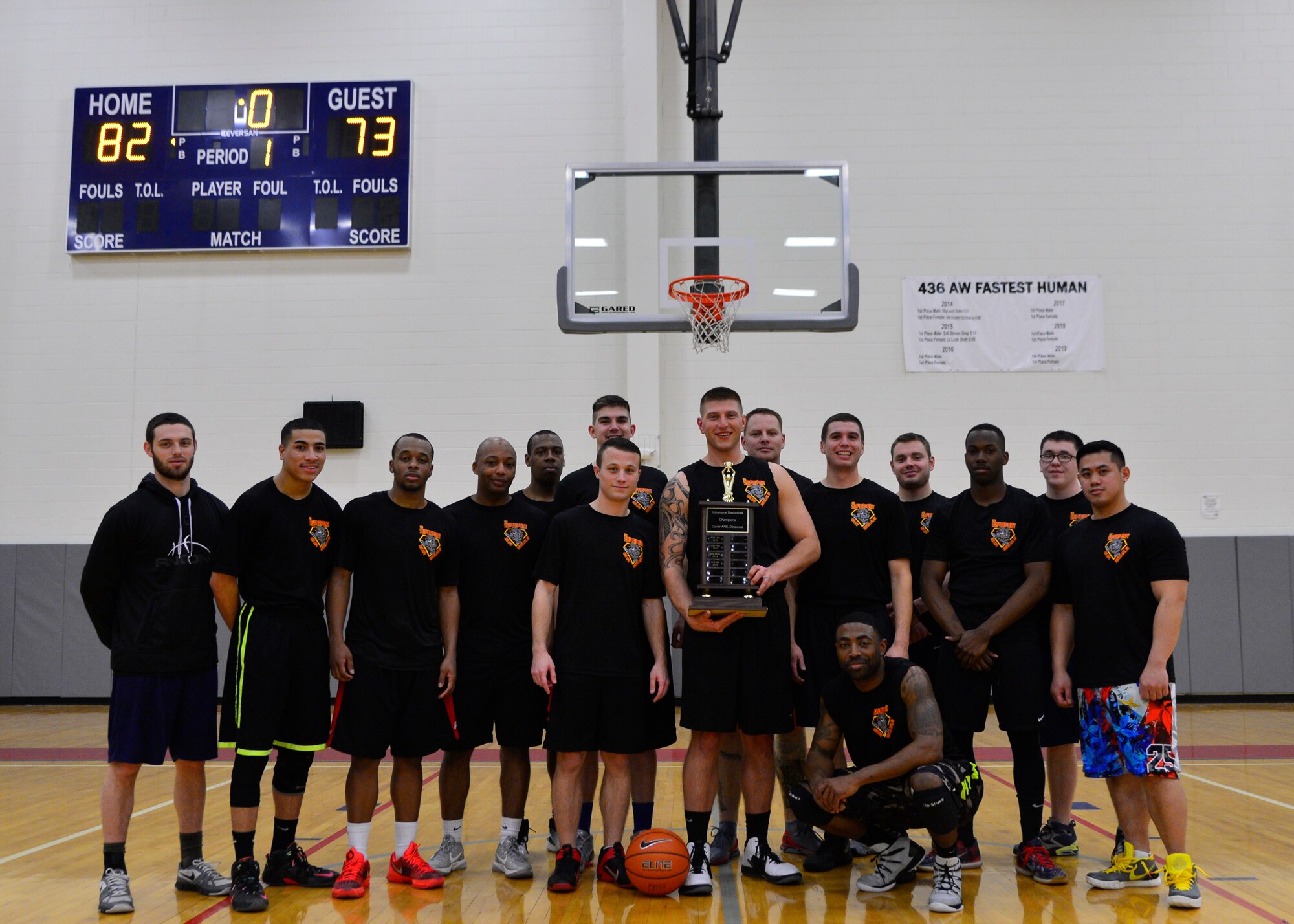 The 436th Aerial Port Squadron intramural basketball team poses with the championship trophy after defeating the 436th Force Support Squadron/512th Airlift Wing 82-73 in the intramural basketball championship game March 1, 2016, at the Fitness Center on Dover Air Force Base, Del. The 436th APS went a perfect 17-0 during their championship run. (U.S. Air Force photo/Senior Airman William Johnson)