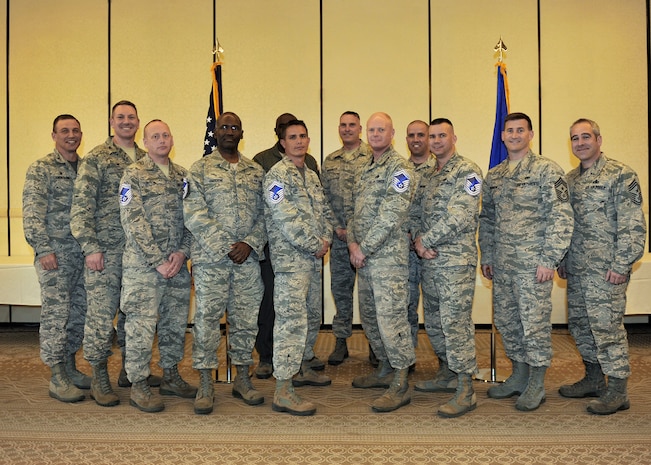 Joint Base Charleston's newest Senior Master Sergeant selects pose for a group photo with leadership from both the 628th Air Base Wing and the 437th Airlift Wing during the promotion selection party held at the Charleston Club, March 4, 2016. The base had 11 selectees total, representing the 12.32 percent of all promotees. (U.S. Air Force photo/Tech. Sgt. Renae Pittman)