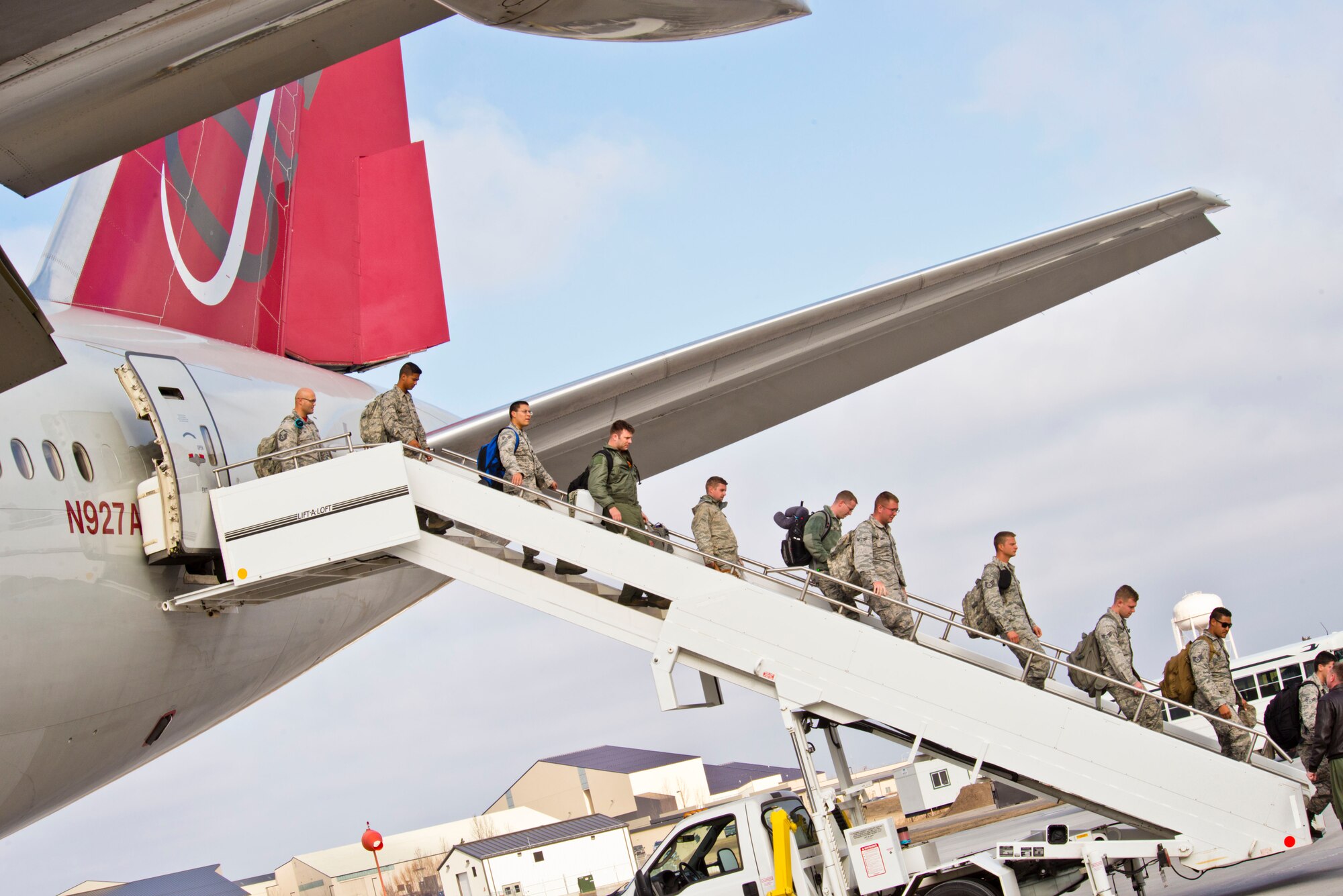 Members of the 5th Bomb Wing exit an aircraft at Minot Air Force Base, N.D., March 4, 2016 returning from Andersen Air Base, Guam. Air Force Global Strike Command continues to routinely deploy bombers to Andersen AB which provides opportunities for our Airmen to advance and strengthen regional alliances and our long-standing military-to-military partnerships throughout the Indo-Asia-Pacific. (U.S. Air Force photo/Airman 1st Class J.T. Armstrong)