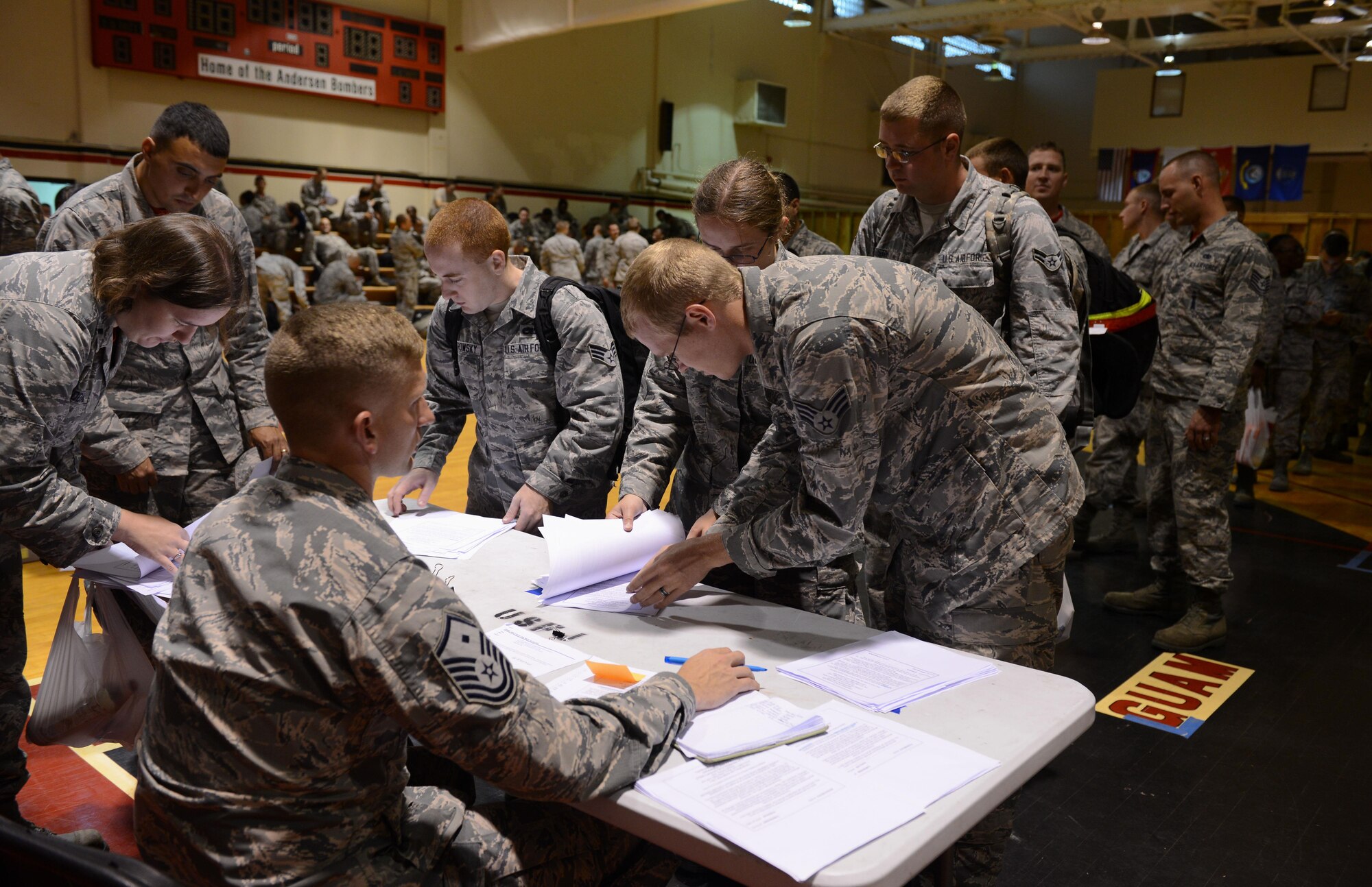 Airmen deployed from Minot Air Force Base, N.D., out- process from Andersen Air Force Base, Guam, on March 4, 2016. A new rotation of aircrews, maintenance personnel and aircraft from Minot AFB arrived on Guam to replace the 23rd EBS in support of the U.S. Pacific Command’s continuous bomber presence mission. (U.S. Air Force photo/Airman 1st Class Arielle Vasquez)